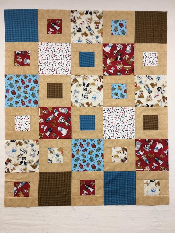 Home is Where the Dog is.  pattern Sheryl, size 48 X 57.